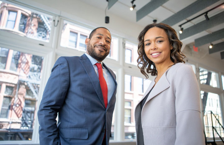 business people smiling at camera