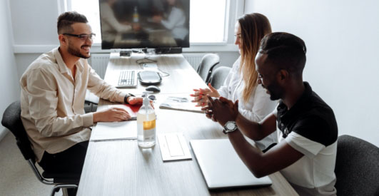 people working at a conference table